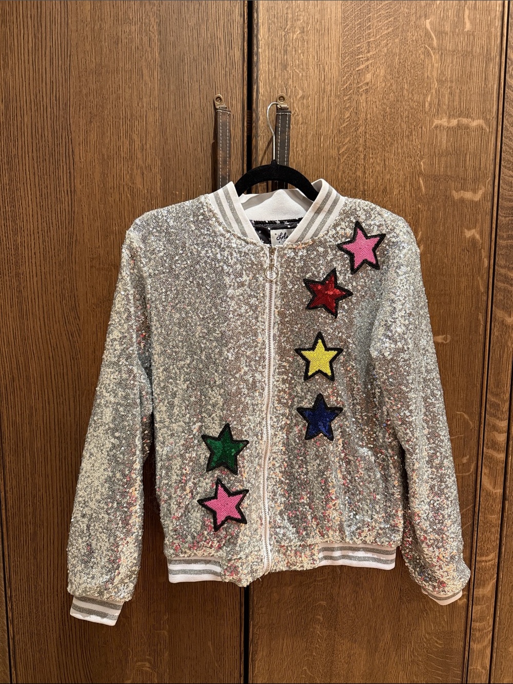 Lola + The Boys Silver Sequin Bomber Jacket with Multicolor Star Patches
